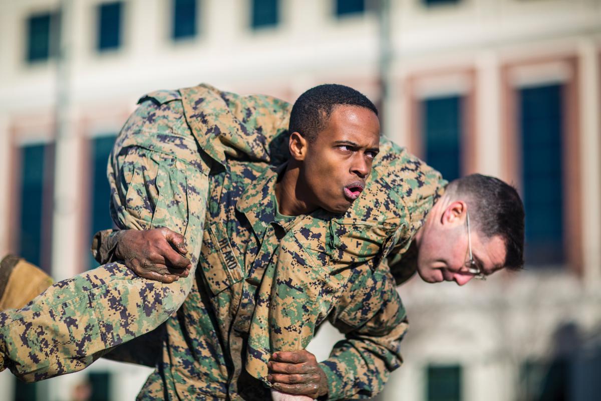 A Marine conducts a fireman carry