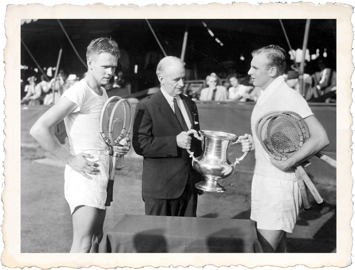 Joe Hunt receiving a tennis trophy