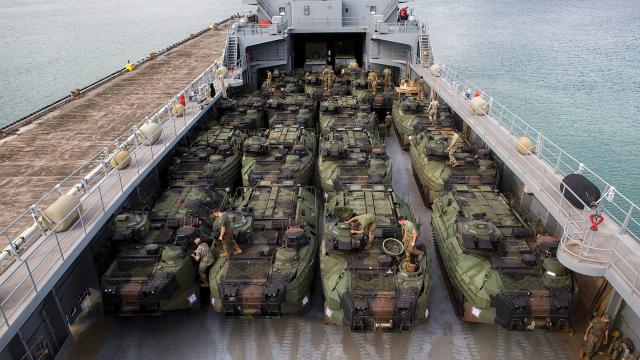 U.S. Marines Corps assault amphibious vehicles from the Combat Assault Company, 3d Marine Littoral Regiment, are loaded onto a U.S. Army logistic support vessel at Marine Corps Base Hawaii, Kaneohe Bay. Army watercraft  perform a variety of essential missions, from intratheater distribution to ship-to-shore operations throughout the Indo-Pacific.