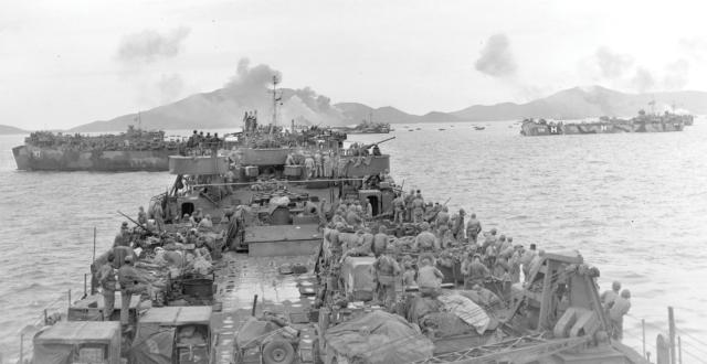 Marines on board Navy tank landing ships prepare to land at Okinawa