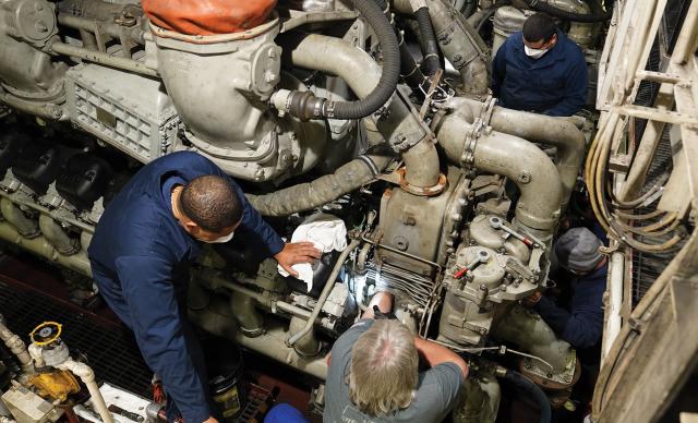 Machinery technicians work alongside a civilian contractor to perform maintenance on one of the USCGC Stratton’s (WMSL-752) main diesel engines. Learning alongside contracted technicians—particularly representatives from original manufacturers—while in port would enhance a crew’s understating of their ship’s equipment. 