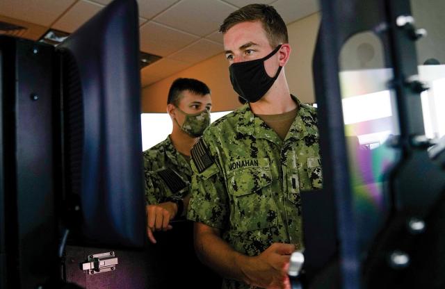 Shore-based submarine trainers today, such as the Submarine Plotting and Navigation Trainer at Naval Submarine Training Center Pacific, include a control room that is configured to mimic a submarine attack center.