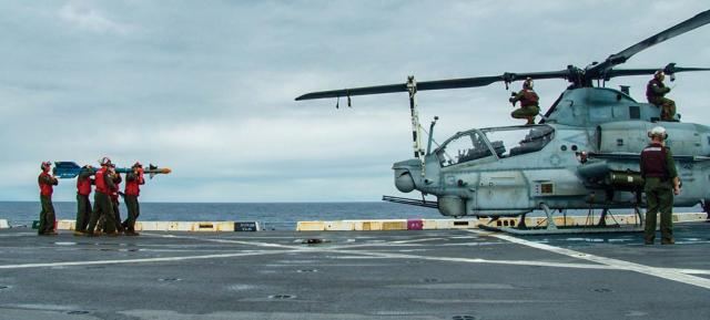 Marines prepare an AH-1Z helicopter on the flight deck of the USS Green Bay (LPD-20) in January 2023. Marine Corps force modernization efforts have led to some aviation reorganization, but a MEU remains a strong combined-arms force with a capable air combat element.