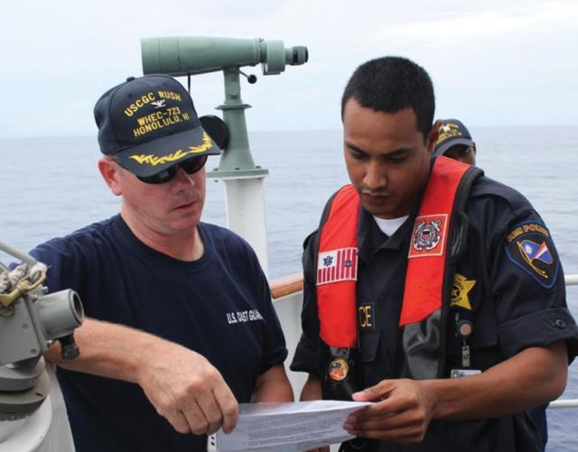 A Coast Guard captain and a shiprider from the Republic of the Marshall Islands prepare to conduct a boarding. Many Indo-Pacific nations already have agreements with the U.S. Coast Guard, including shiprider provisions that enable combined maritime law enforcement operations.