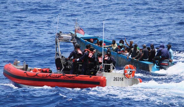 A small boat crew from the USCGC Donald Horsley (WPC-1117) interdicts a vessel in the Mona Passage in May 2023. The migrants were returned to the Dominican Republic. 