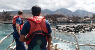 A Reserve boat crew from U.S. Coast Guard Station Honolulu patrols off Lahaina Harbor, Maui, following the August wildfire. Sector Honolulu assets assisted with search and rescue, maritime safety, pollution response, and damage assessment. 
