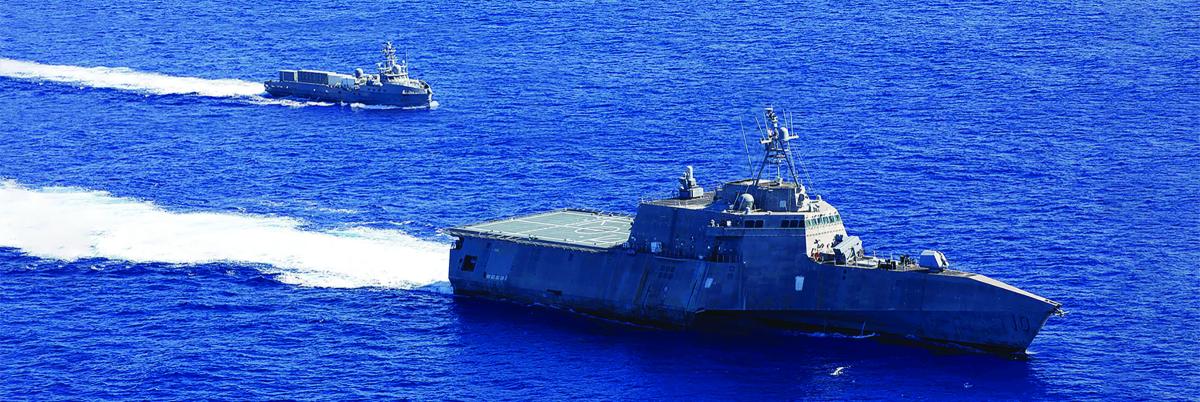The USS Gabrielle Giffords (LCS-10) sails with the unmanned surface vessel Ranger in the Pacific Ocean in September 2023. 