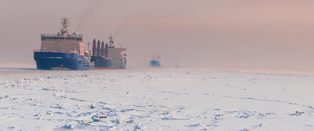 A Russian icebreaker leads ships through Arctic ice. 