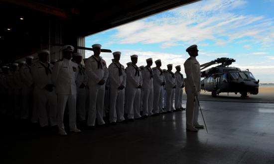 Sailors stand in formation during a change of command ceremony. Cmdr. Brad L. Arthur relieved Cmdr. Brian K. Pummill as commanding officer of Helicopter Sea Combat Squadron (HSC) 9 at a change of command ceremony