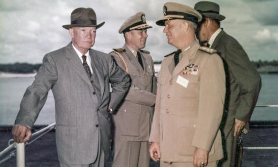 President Dwight D. Eisenhower with Admiral  Arleigh A. Burke, USN, Chief of Naval Operations, visting USS Saratoga (CVA-60) on 6 June 1957.