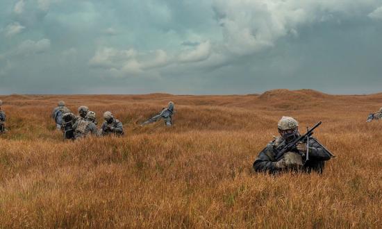 Members of a West Coast–based Naval Special Warfare command set security during an exercise.