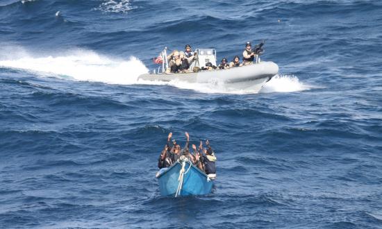 In response to “Unleash the Privateers” in the April Proceedings, some writers have observed that, even if U.S. law recognizes letters of marque, other countries probably will not, and U.S. privateers could be treated as pirates. In this photo, a team from the USS Pinckney (DDG-91) approaches suspected pirates in the Gulf of Aden.