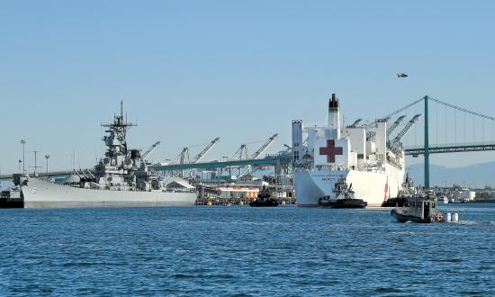 Deployed to support the nation’s COVID-19 response, the hospital ships Mercy—shown sailing past the USS Iowa Museum—and Comfort were welcome sights, but both are 44 years old. If the Navy is serious about replacing them, there are options.