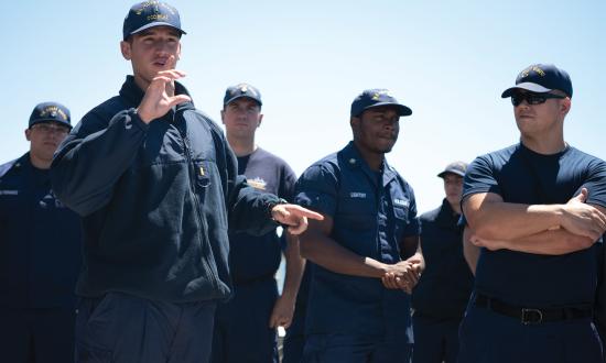 A briefing on board the USCGC Bear (WMEC-901). Regular check-ins and evaluations can identify areas for improvement and ensure service members are always striving to be the best versions of themselves.