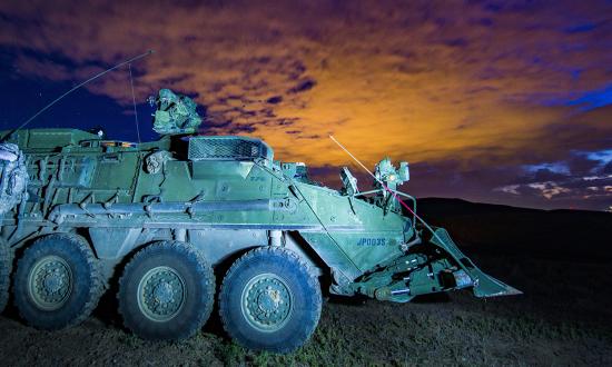 An M1132 Engineer Squad Vehicle belonging to Alpha Company, 898th Brigade Engineer Battalion, 81st Stryker Brigade Combat Team, sits under the night sky on a demolitions range at Yakima Training Center, Yakima, Wash., July 12, 2018. The M1132 is the combat engineering variant of the Stryker armored fighting vehicle. 