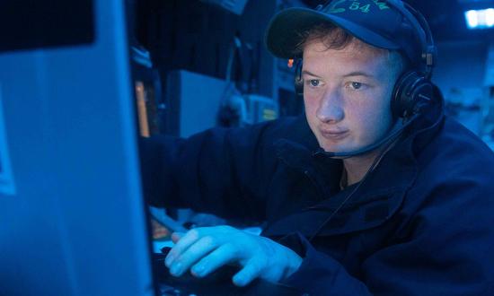 A CTT monitors radio frequencies on board the USS Antietam (CG-54) in July 2023. The role of today’s Navy linguist seems to have simplified to mere translational work, with none of the formal analytical training given to the valiant linguists in the past.  