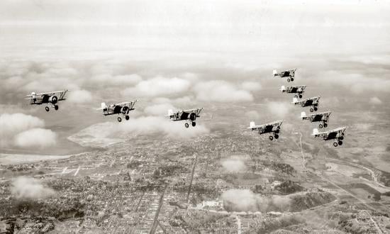 Air-to-air view of Curtiss F6C fighters fly in formation over San Diego in 1931