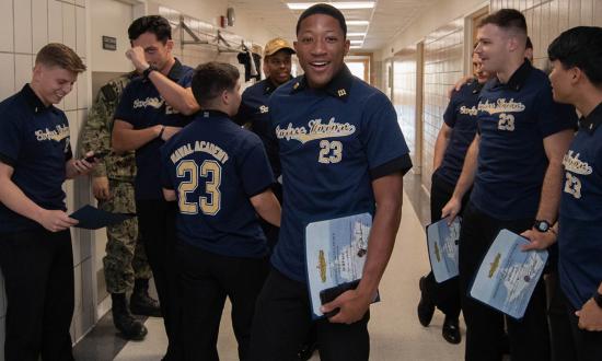 U.S. Naval Academy Class of 2023 midshipmen celebrate their selection as surface warfare officers on service selection night, 17 November 2022. 