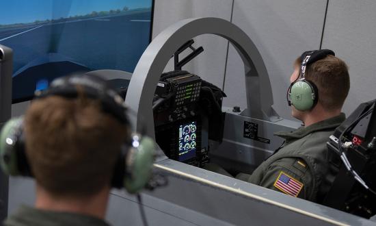 Student naval aviators operate a flight simulator for training in the T-6B Texan II. The ability to take ground school knowledge from the classroom to the cockpit is what separates future naval aviators from those who may not make it. 