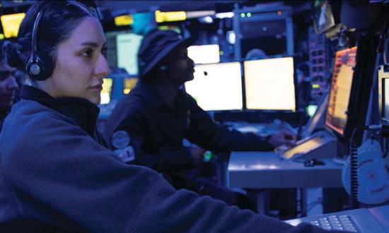 A cryptologic technician monitors electronic warfare (EW) sensors on board the USS Makin Island (LHD-8). Advances in artificial intelligence and machine learning can enable cognitive EW systems—real-time learning and thinking systems that cannot be distracted like human operators.