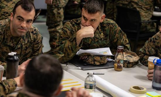 U.S. Marines discuss plans during an annual training period on Marine Corps Base Quantico, Virginia, in March 2023. In recent years, the current officer PME enterprise has been accused of not adequately preparing U.S. military officers for the challenges of the modern operating environment 