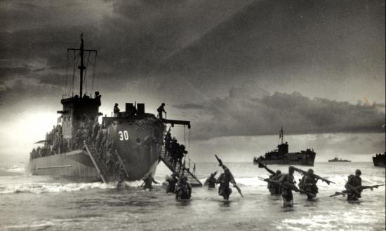Troops from USS LCI(L)-30 reach the beach in the second wave of the invasion of Sarmi, Dutch New Guinea
