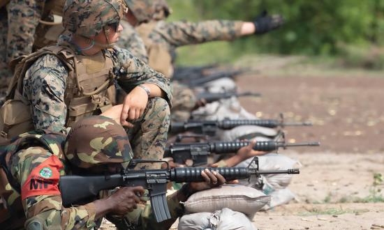 U.S. Marines train with a member of the Ghana armed forces in marksmanship near Daboya, Ghana, during African Lion 23. Headquartering AfriCom in Africa would enhance its ability to support and cooperate with African nations.