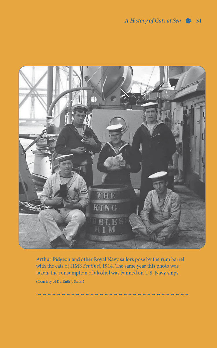 Arthur Pidgeon and other Royal Navy sailors pose by the rum barrel with the cats of HMS Sentinel, 1914.