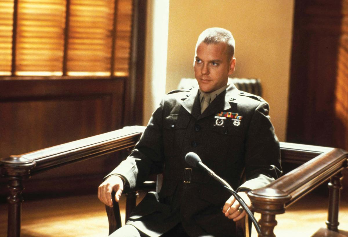 Second Lieutenant Jonathan  Kendrick (Kiefer Sutherland) seated in the courtroom in a still from the 1992 film A Few Good Men