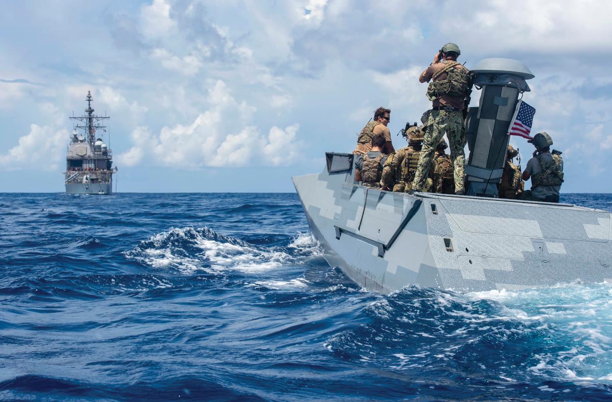 Sailors assigned to Special Boat Team 12 and Explosive Ordnance Disposal (EOD) Mobile Unit 5 prepare to board the Ticonderoga-class guided-missile cruiser USS Antietam (CG_54)