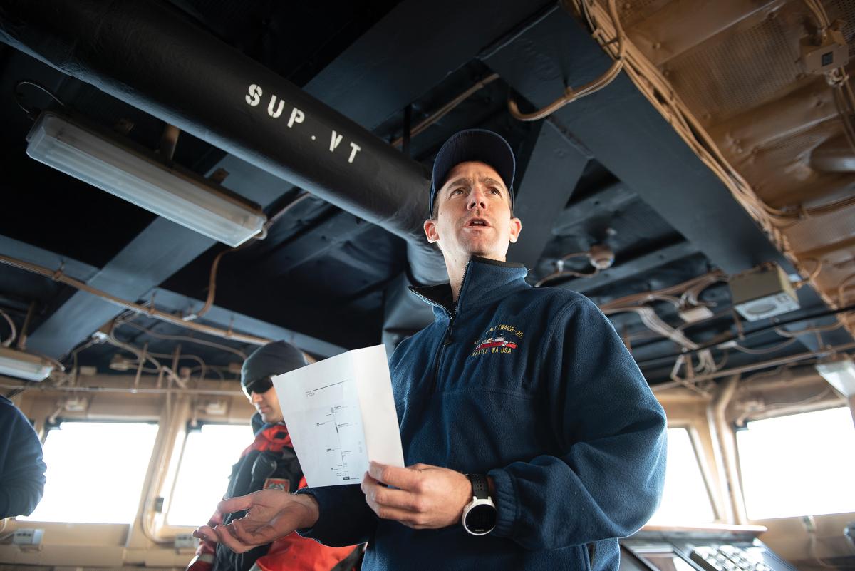 U.S. Coast Guard Lt. Cmdr. James Toomey goes over a plan to drop a navigation beacon Wednesday, Sept. 19, 2018, on the bridge of the Coast Guard Cutter Healy (WAGB-20) approximately 100 miles northwest of Barrow, Alaska, in the Chukchi Sea