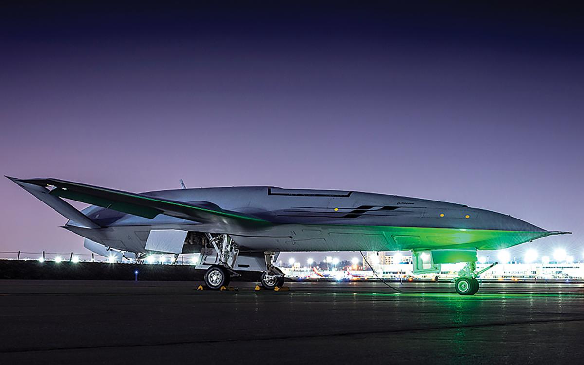 Ground-to-ground right side view of a  MQ-25 Stingray at night