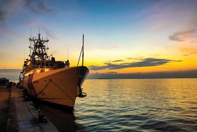 The USCGC Oliver F. Berry (WPC-1124) moors for  a brief port call at U.S. Army Garrison Kwajalein Atoll on 1 July 2018, while  forward deployed to the Republic of the Marshall Islands in support of U.S. Indo-Pacific Command.