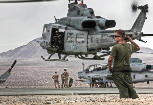 rine monitors flight launch operations at 29 Palms as part of Marine Light Attack Helicopter Squadron 367, 2011.