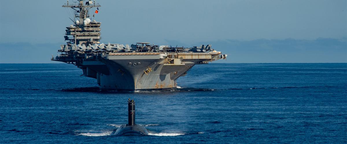 USS Ronald Reagan (CVN-76) and a Los Angeles–class fast-attack submarine