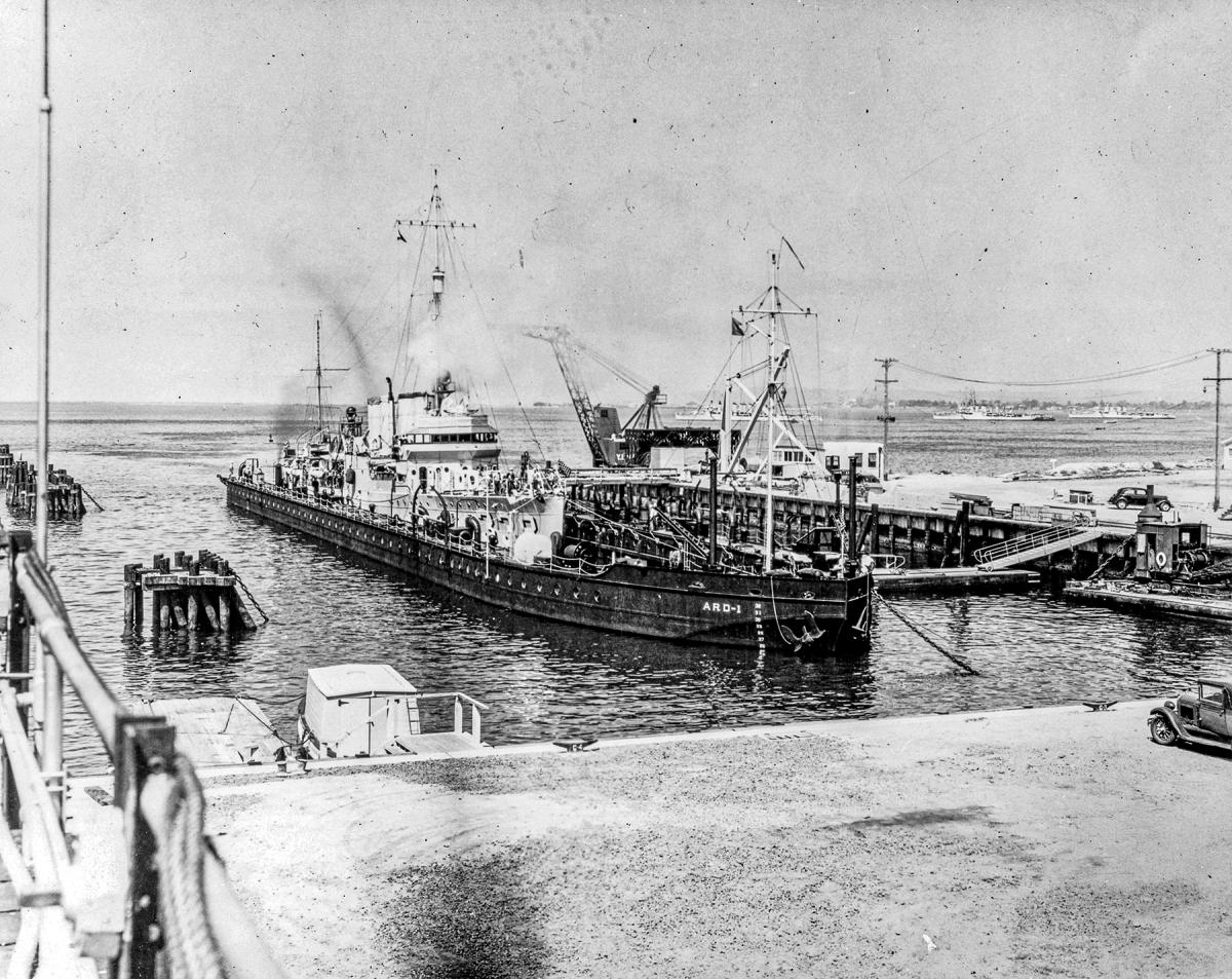USS Wasmuth (DD-338) moving in to ARD-1 at San Diego, 1935.