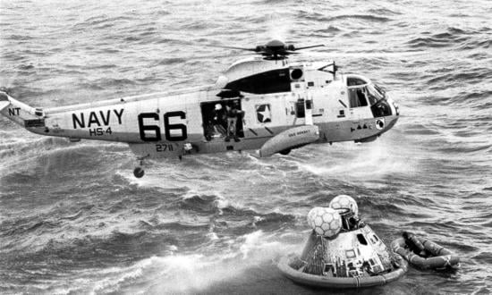 A Navy UDT swimmer prepares to jump into the water during recovery of the Apollo 11 space capsule