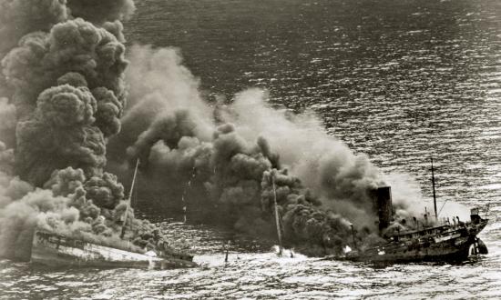 An Allied tanker sinks into the Atlantic after being torpedoed by a U-boat.